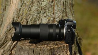 The Nikon mount version of the Tamron 18-300mm f/3.5-6.3 lens photographed outdoors