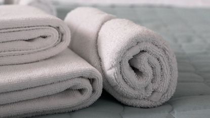Gray towels rolled and folded