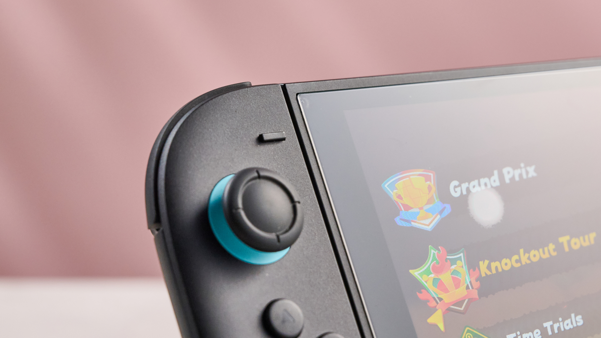 A closeup of the corner of the Snakebyte Starter Kit S2 screen protector – apart from a prominent bubble, it doesn't affect the visibility of Mario Kart World on the Switch 2 screen.