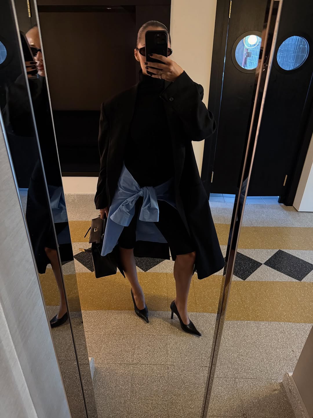 woman wearing black turtleneck outfit fall 2025