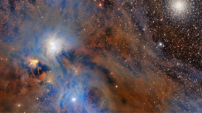 a colorful cloud of gas next to twinkling stars, in space