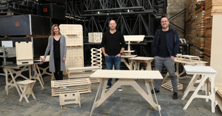 Instead of building structures for events, Stagekings turned its resources to building work-from-home desks during the COVID-19 pandemic.. Pictured: Tabitha and Jeremy Fleming with head of production Mick Jessop.