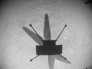 An image taken by the Ingenuity helicopter of its shadow on Mars during the chopper's ninth flight, on July 5, 2021.