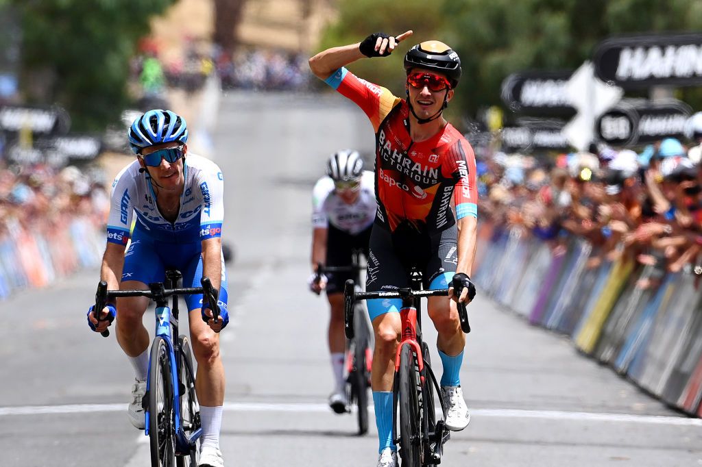 CAMPBELLTOWN AUSTRALIA JANUARY 20 Pello Bilbao Lopez de Armentia of Spain and Team Bahrain Victorious celebrates at finish line as stage winner ahead of Simon Yates of United Kingdom and Team Jayco Alula and Jay Vine of Australia and UAE Team Emirates Polka dot Mountain Jersey during the 23rd Santos Tour Down Under 2023 Stage 3 a 1168km stage from Norwood to Campbelltown TourDownUnder WorldTour on January 20 2023 in Campbelltown Australia Photo by Tim de WaeleGetty Images