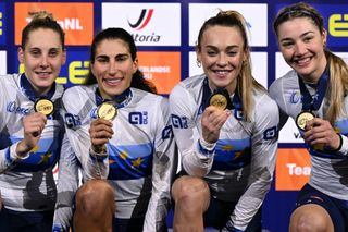 First placed Italy's Vittoria Guazzini (L), Italy's Elisa Balsamo, Italy's Letizia Paternoster and Italy's Martina Fidanza celebrate and pose with gold medals on the podium for the Women's Team Pursuit finals race during the second day of the UEC European Track Cycling Championships at the Omnisport indoor arena in Apeldoorn, on January 11, 2024. (Photo by JOHN THYS / AFP)