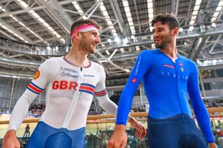 Picture by Will Palmer/SWpix.com - 06/08/2023 - Track & Para Track Cycling - 2023 UCI Cycling World Championships - Sir Chris Hoy Velodrome, Glasgow, Scotland - Men’s Elite Individual Pursuit Final - Filippo Ganna Filippo of Italy and Daniel Bigham of United Kingdom together after there face off in the Men’s Elite Individual Pursuit Final.