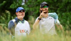 Rodgers talks to his caddie at the US Open