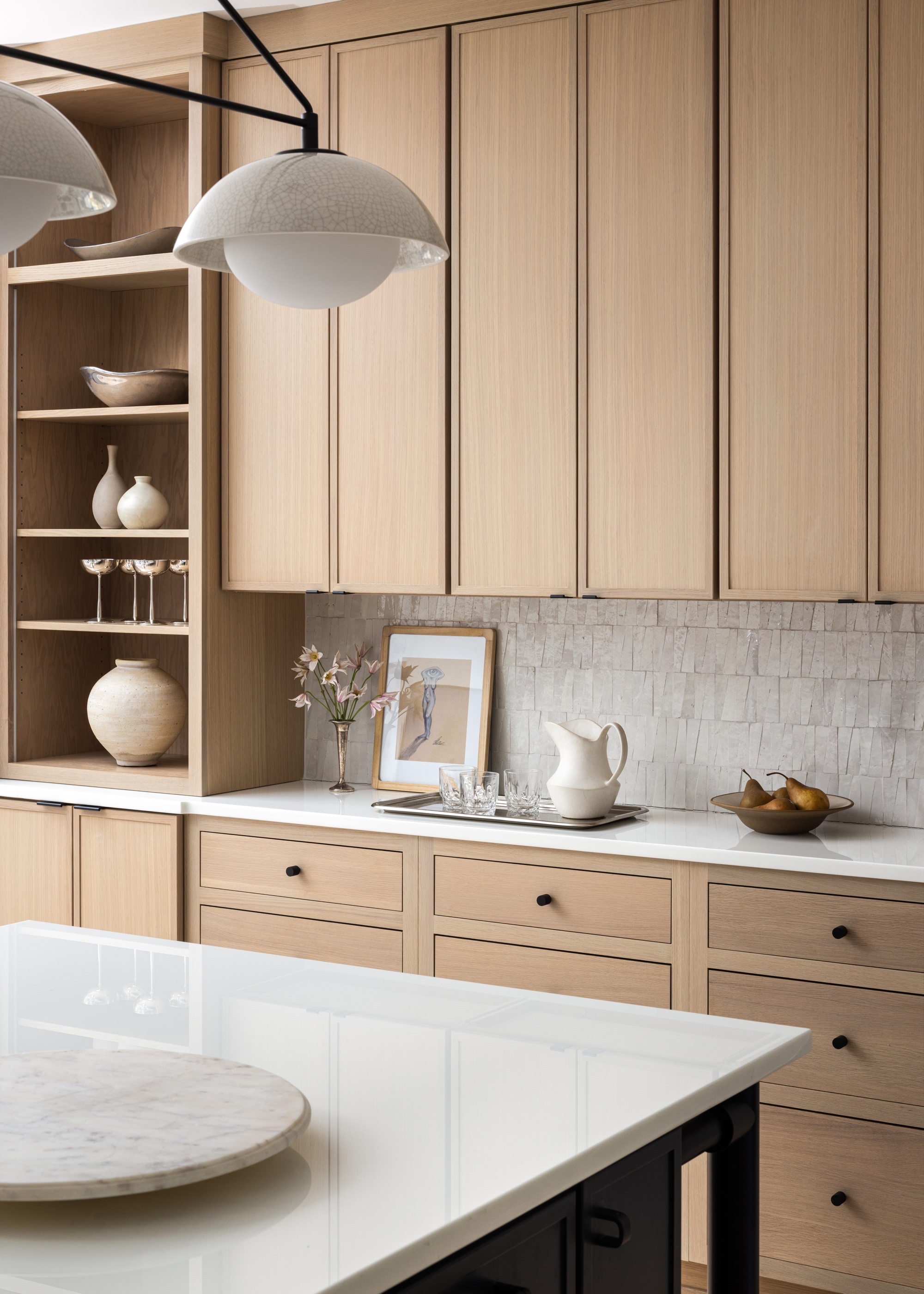 wood kitchen cabinets with zellige tiles and open shelving