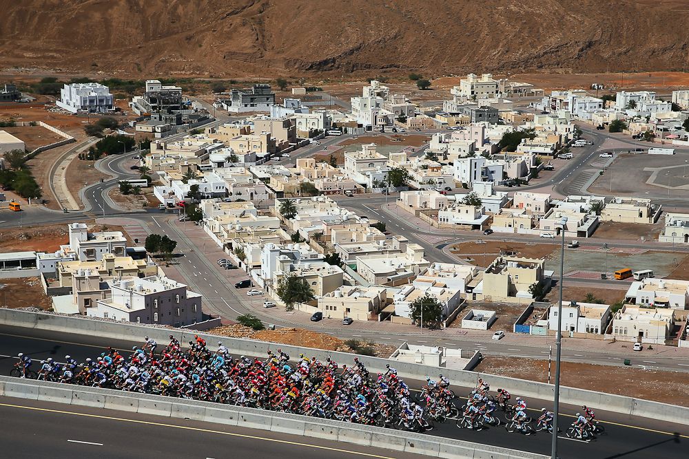 e peloton rides through the Oman countryside during stage two of the 2016 Tour of Oman