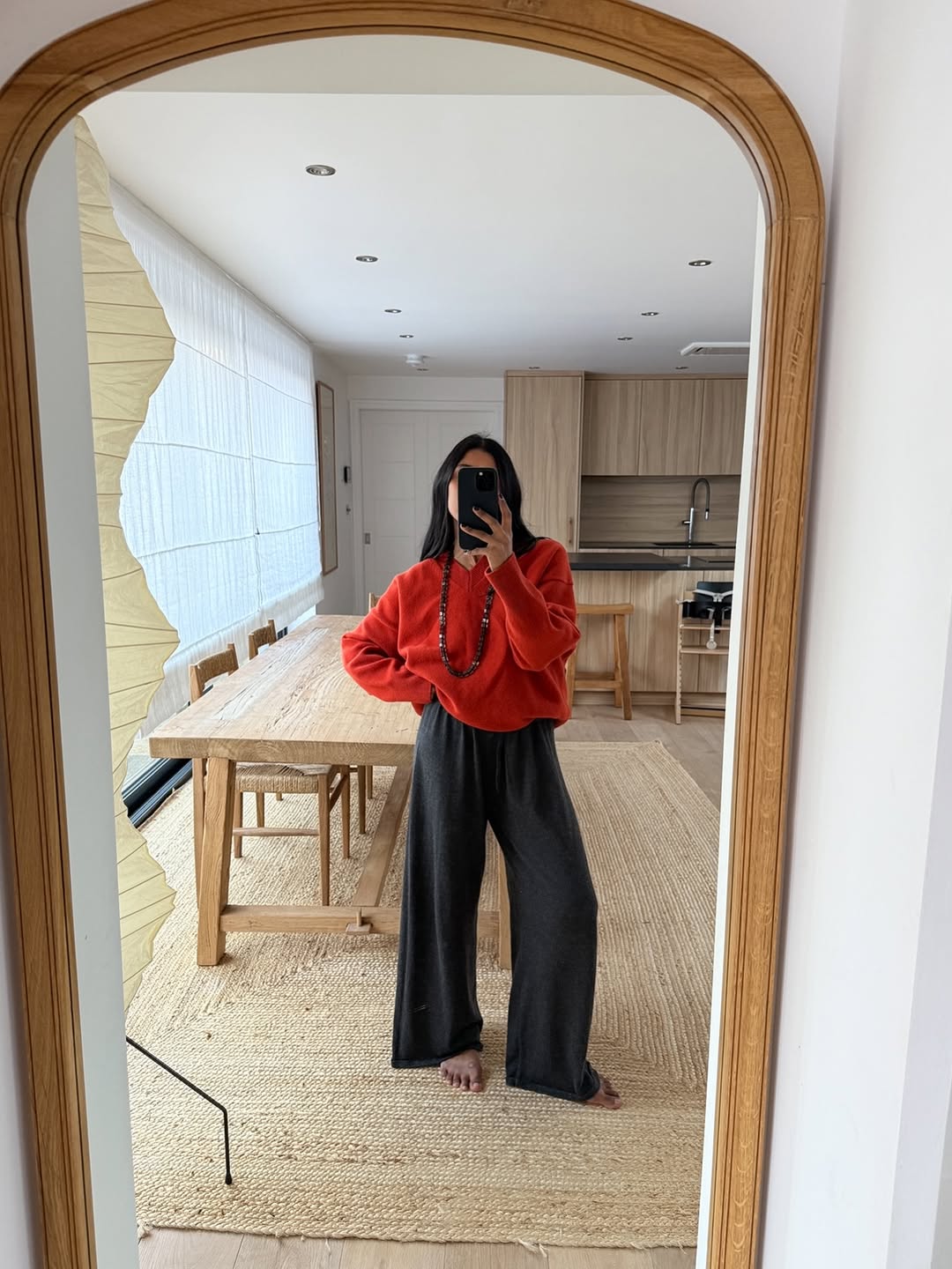 Monikh in scarlet red jumper