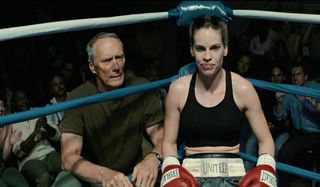 Clint Eastwood and Hilary Swank sit in the corner of the ring in Million Dollar Baby.