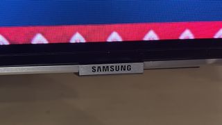 The Samsung QN95B QLED TV on a desk.