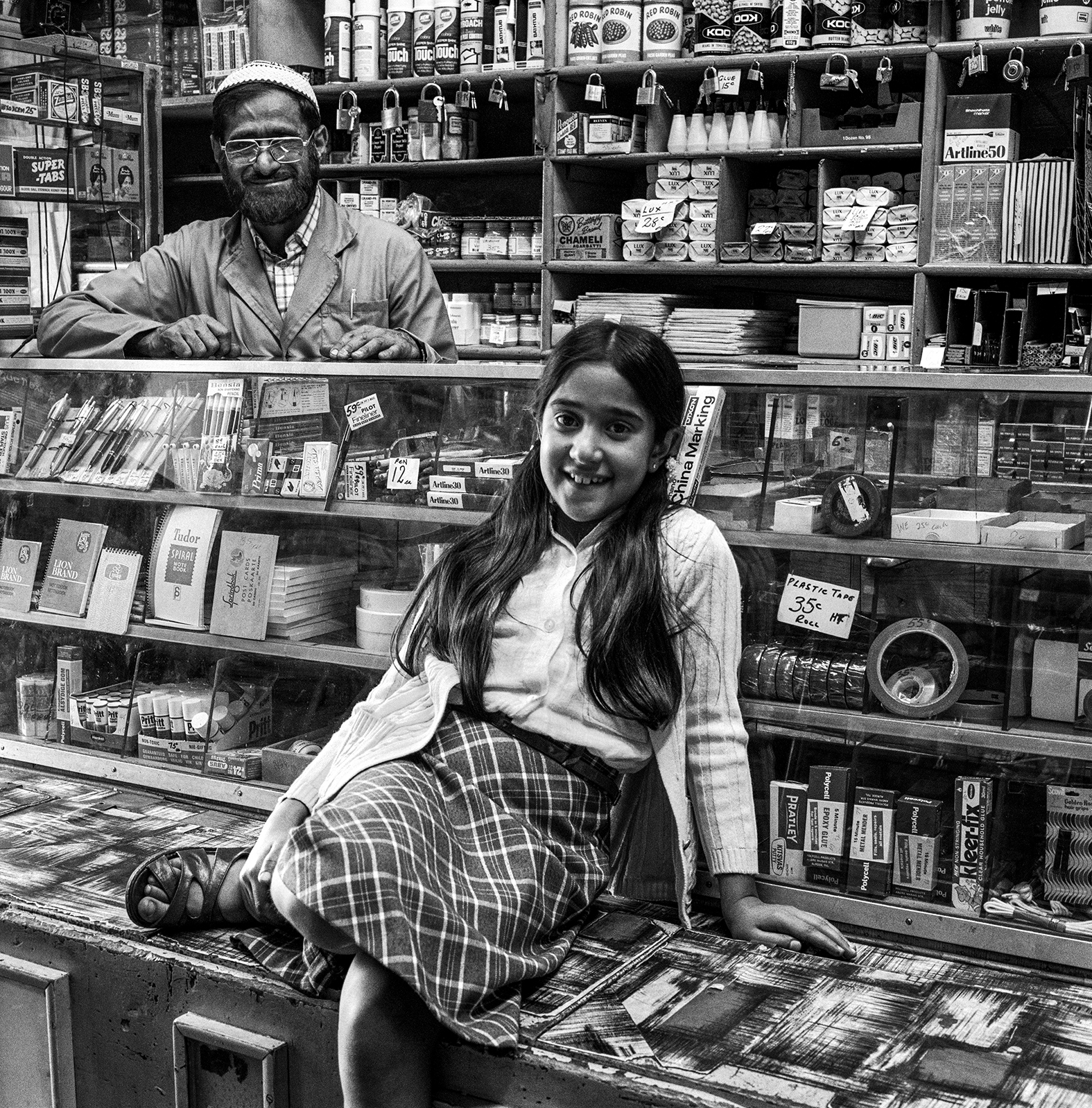 Ozzie Docrat with his daughter Nassima in his shop before its destruction under the Group Areas Act, Fietas, Johannesburg