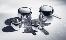 the brand's silversmiths and featuring a sliding lid mechanism