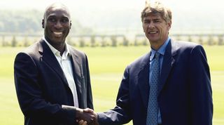 Sol Campbell shakes Arsene Wenger&#039;s hand as he joins Arsenal on a free transfer from Tottenham Hotspur