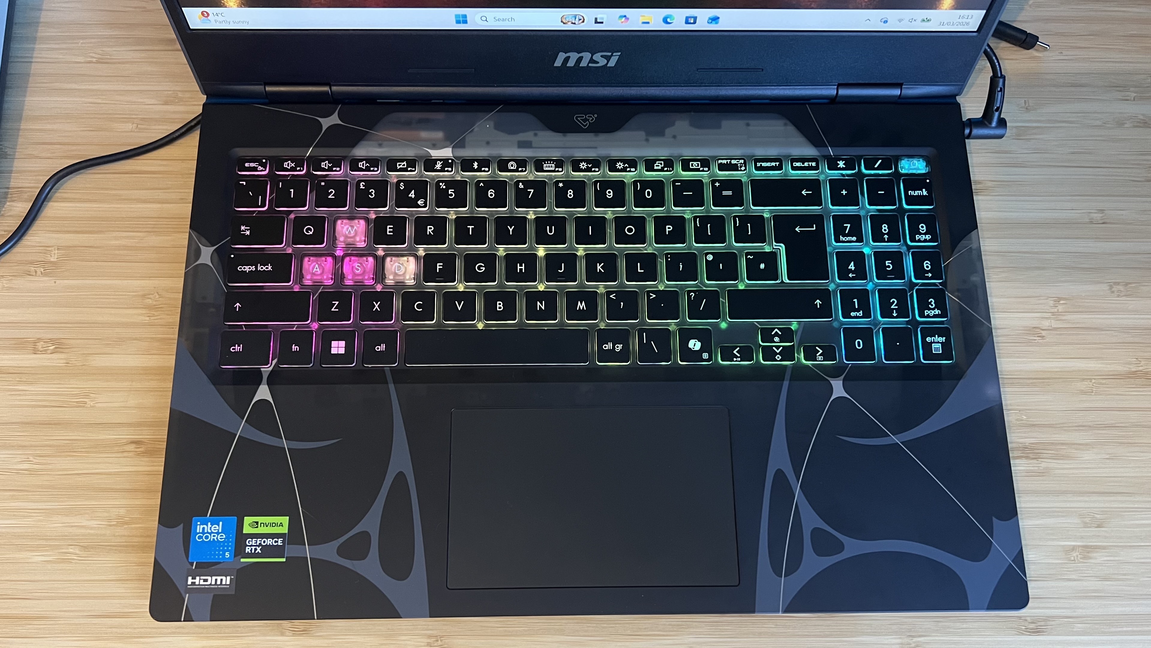Top down view of MSI Cyborg gaming laptop keyboard and main palm rest area