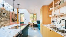 side returned extension with yellow and pink kitchen and terrazzo worktops