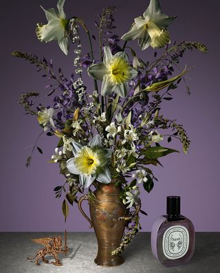 Still life bouquet against a purple background