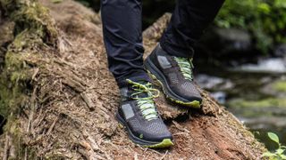 Person's feet wearing Vasque Breeze LT GTX hiking boots