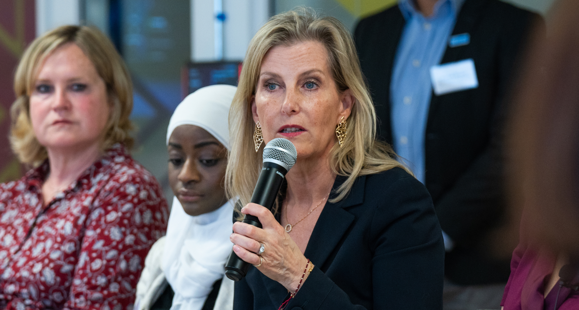 Duchess Sophie speaking into a microphone wearing a black blazer