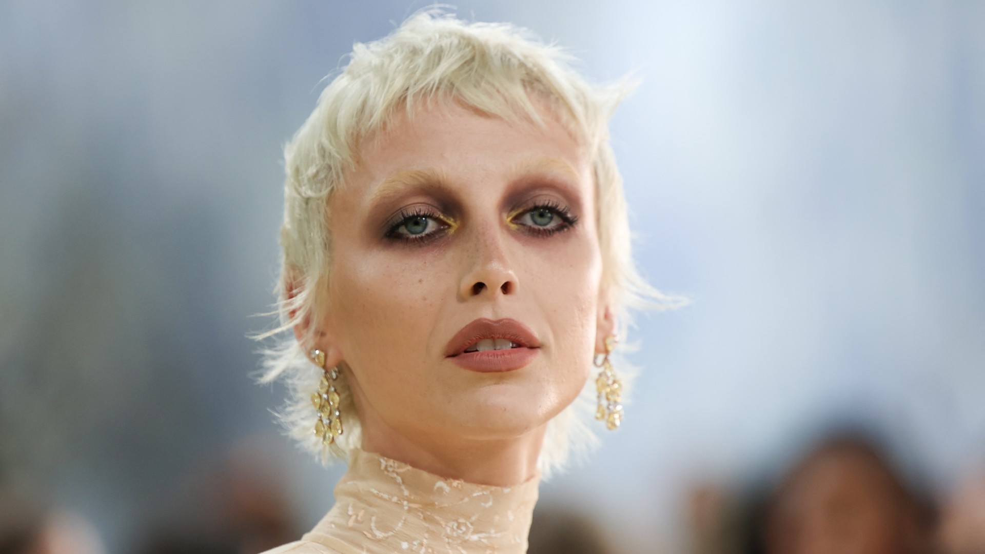 a white woman with a short, blonde pixie cut attends the met gala