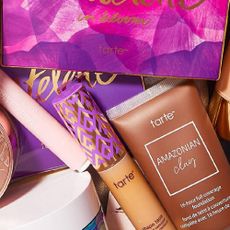 A variety of bestselling Tarte makeup products in a makeup bag. 