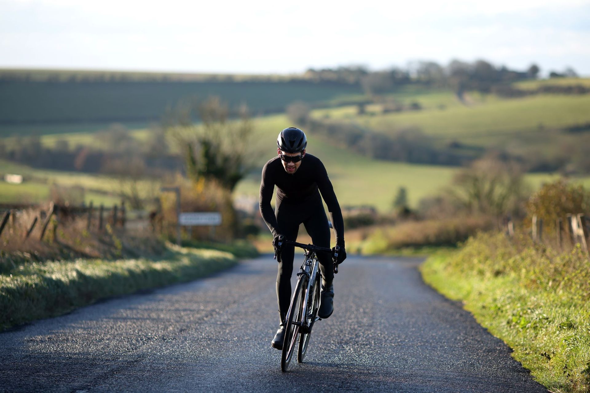 A rider all in black wearing bib tights