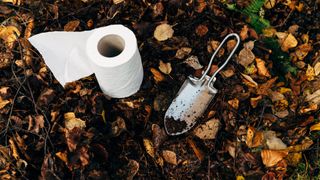 Toilet roll and a trowel ready for going to the toilet on the trail