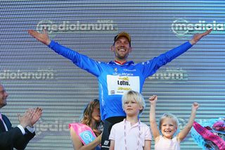 Maarten Tjallingii celebrates with his children on the Giro's stage 3 podium