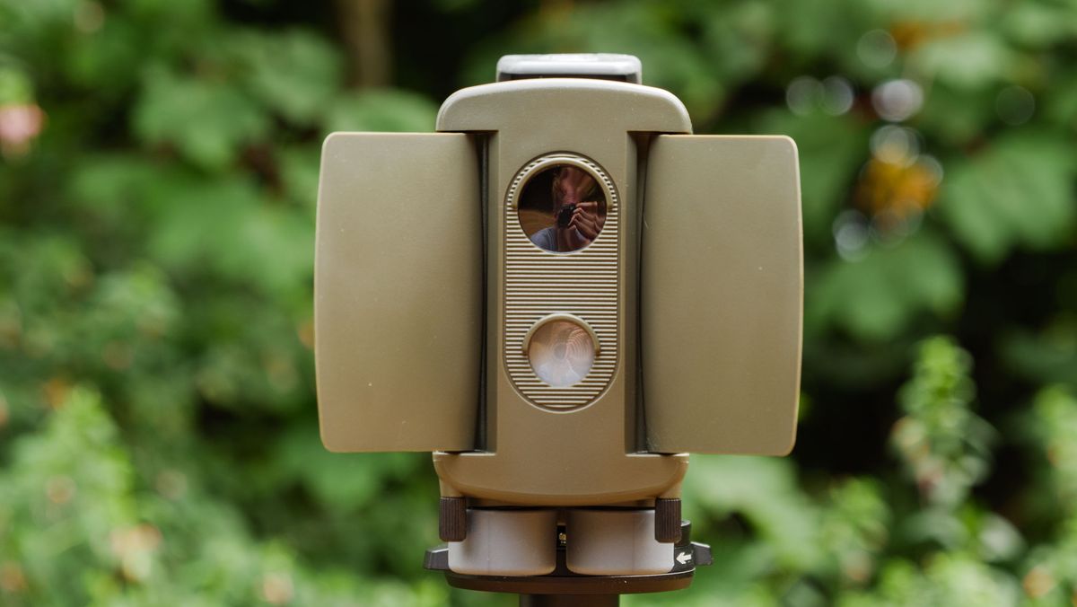 Camtraptions Camera Trap device outdoors with foliage backdrop