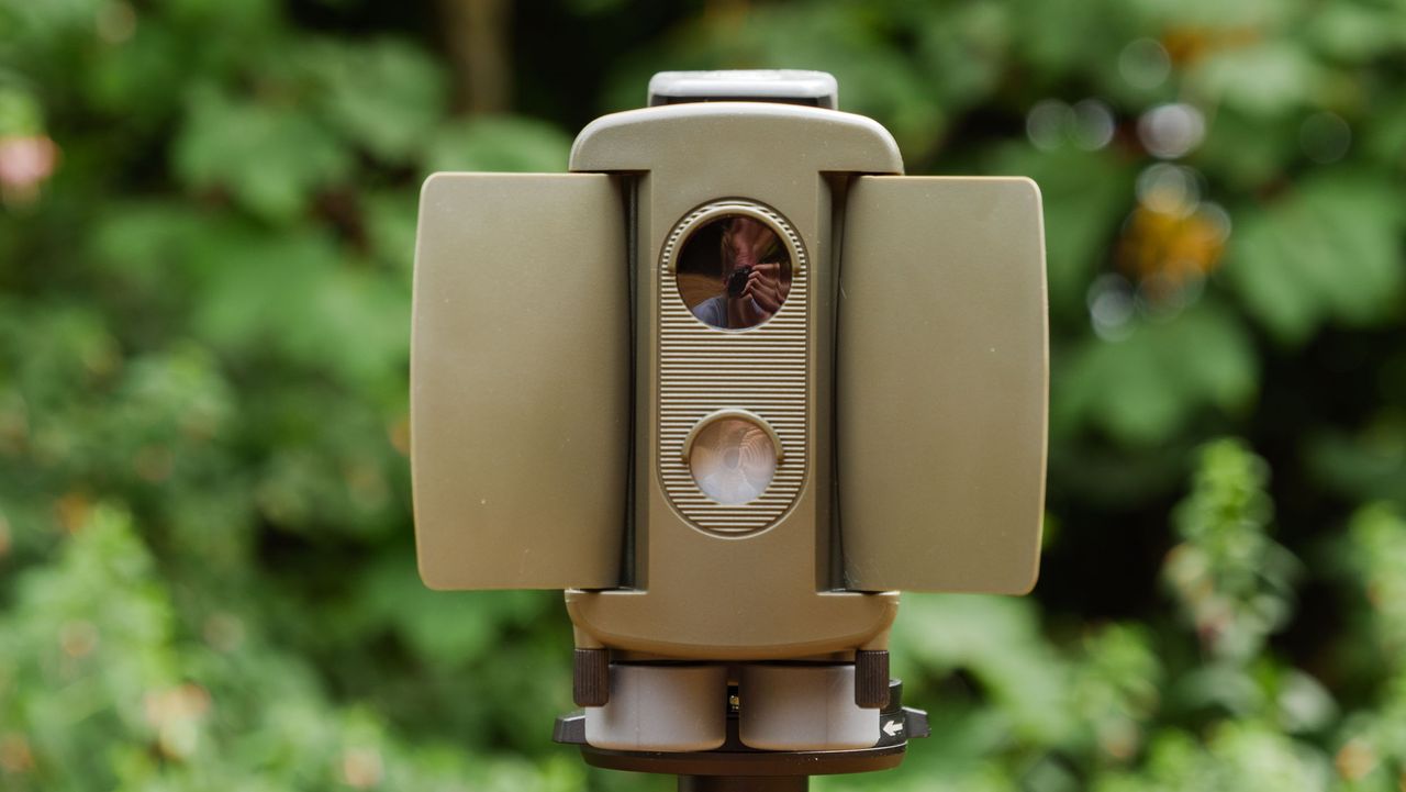 Camtraptions Camera Trap device outdoors with foliage backdrop