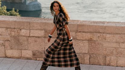 A model wearing a check dress from Next 