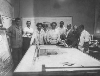 Boris Iofan, his wife Olga, his brother Dmitry, and his team with their prize winning design in the international competition for the Palace of the Soviets