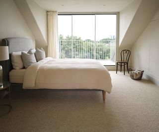 bedroom with neutral carpet