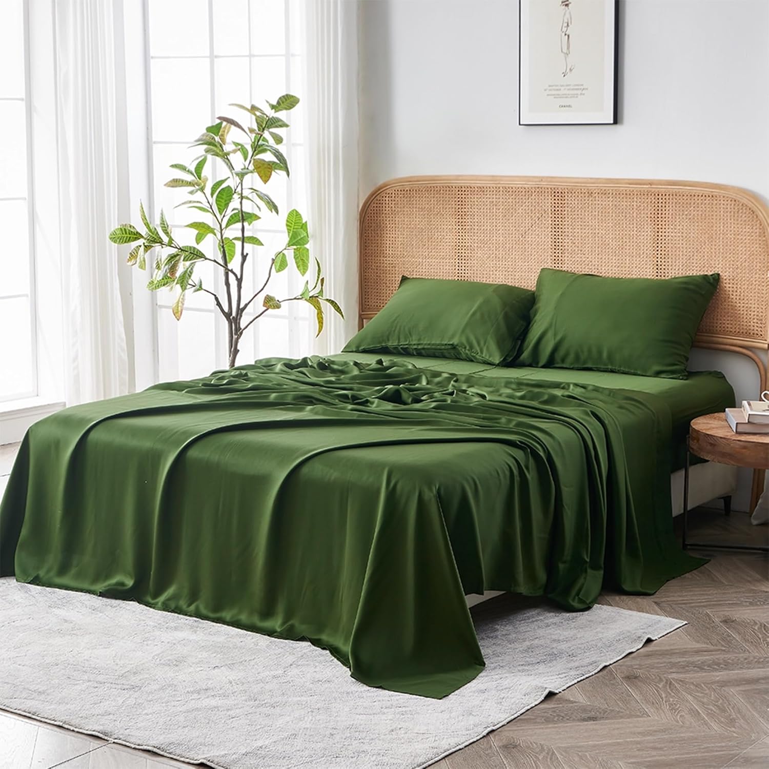 A Sijo Airyweight Eucalyptus Sheet Set in forest green, set up on a bed.