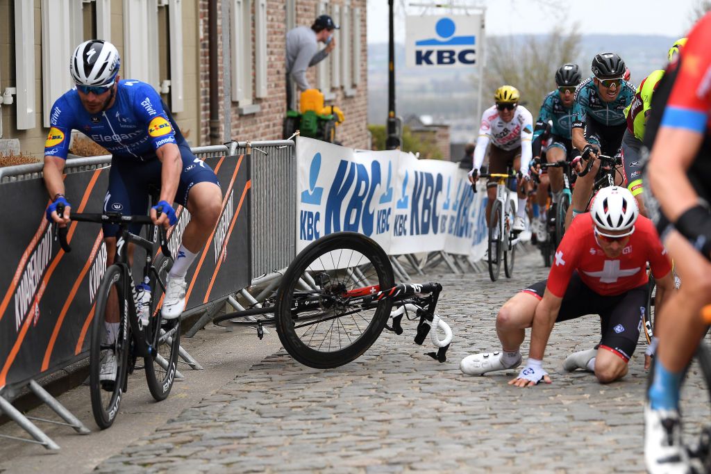 OUDENAARDE BELGIUM APRIL 04 Florian Senechal of France and Team Deceuninck QuickStep Stefan Kung of Switzerland and Team Groupama FDJ during the 105th Ronde van Vlaanderen Tour of Flanders 2021 Mens Elite a 2515km race from Antwerp to Oudenaarde Crash Kwaremont cobblestones sector Mechanical Problem RVV21 rondevanvlaanderen tourofflanders on April 04 2021 in Oudenaarde Belgium Photo by Tim de WaeleGetty Images