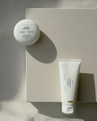 Superegg skin products in round tub and tube displayed on linen board