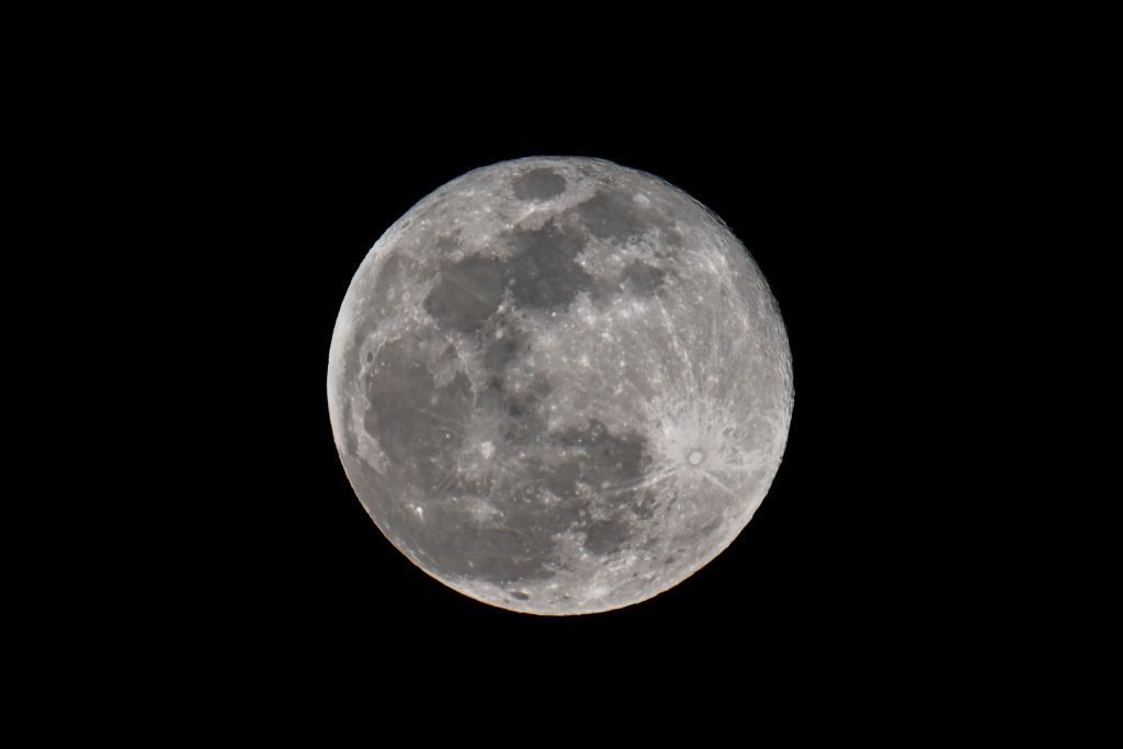 Full Snow Moon rises over San Mateo Bridge of San Francisco Bay in San Mateo, California, United States on February 24, 2024.