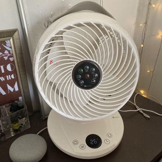 Meaco Fan 650 on brown table top next to fairy lights