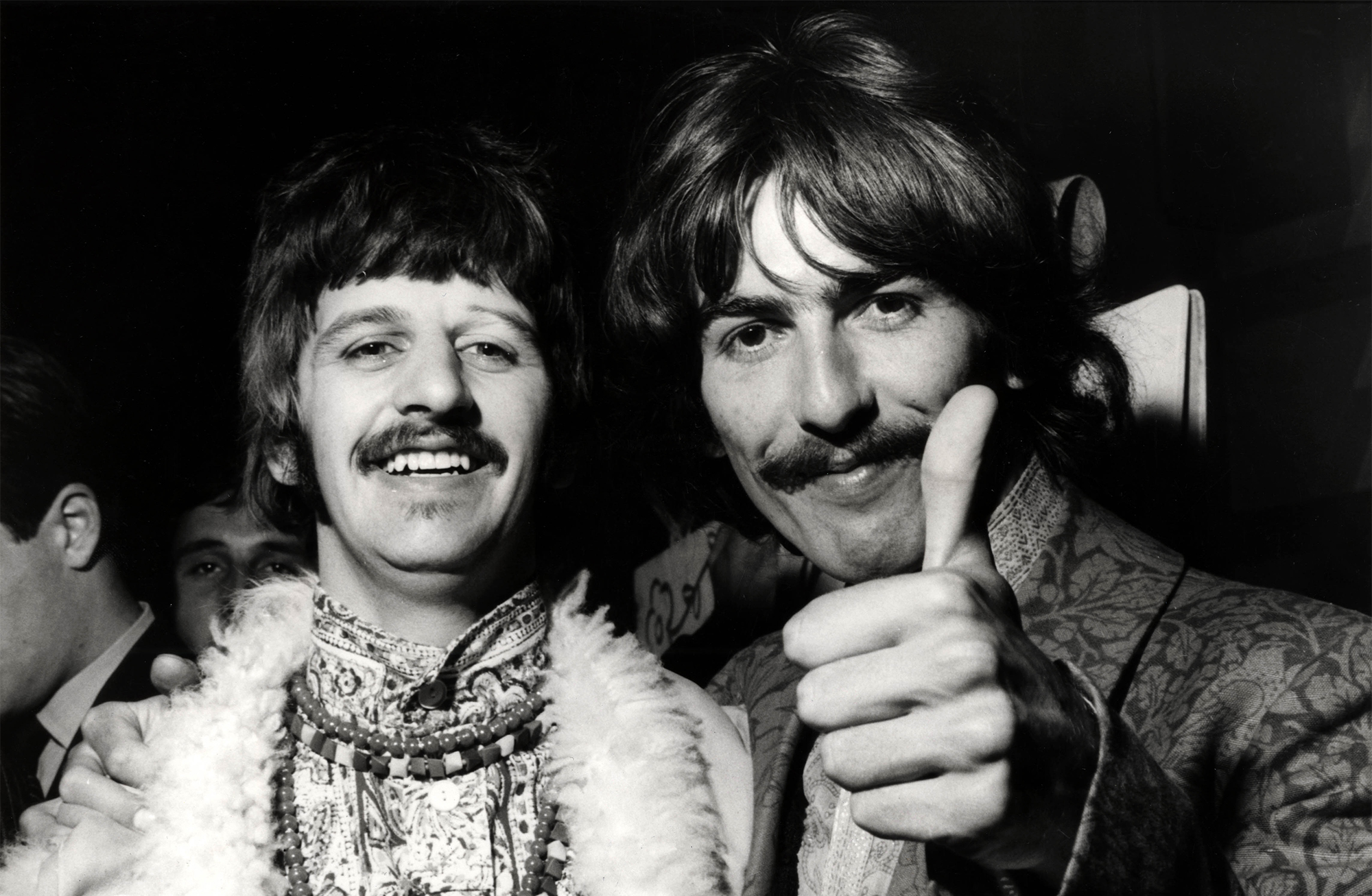 Ringo Starr, George Harrison posed, doing thumbs up, at the Beatles&amp;rsquo; recording session for 'All You Need Is Love' on June 25, 1967