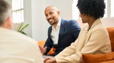 A couple talk to their financial adviser