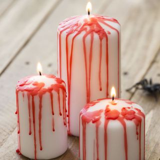 red wax designed on candle and spider