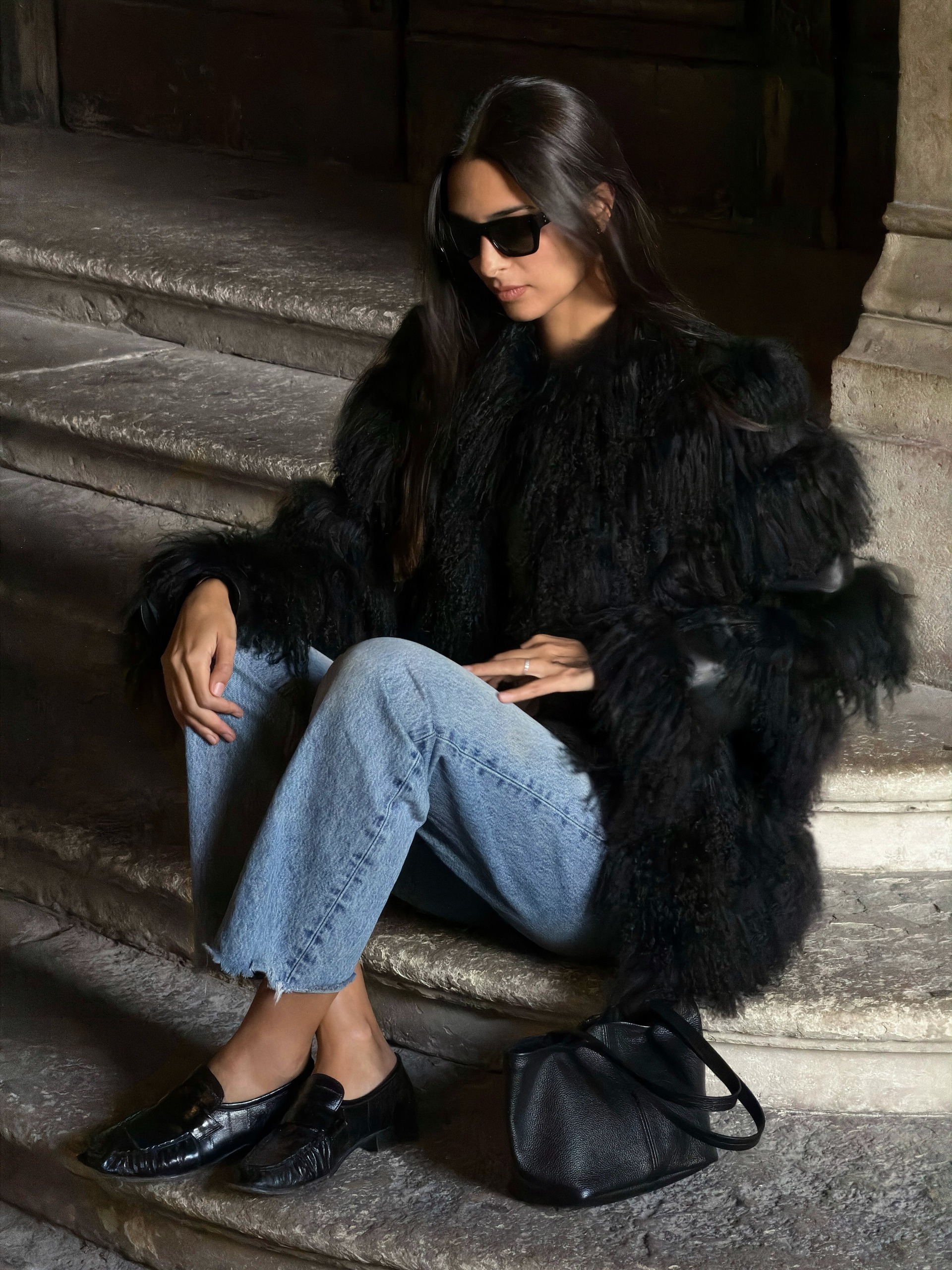 Woman in jeans and ruched loafers