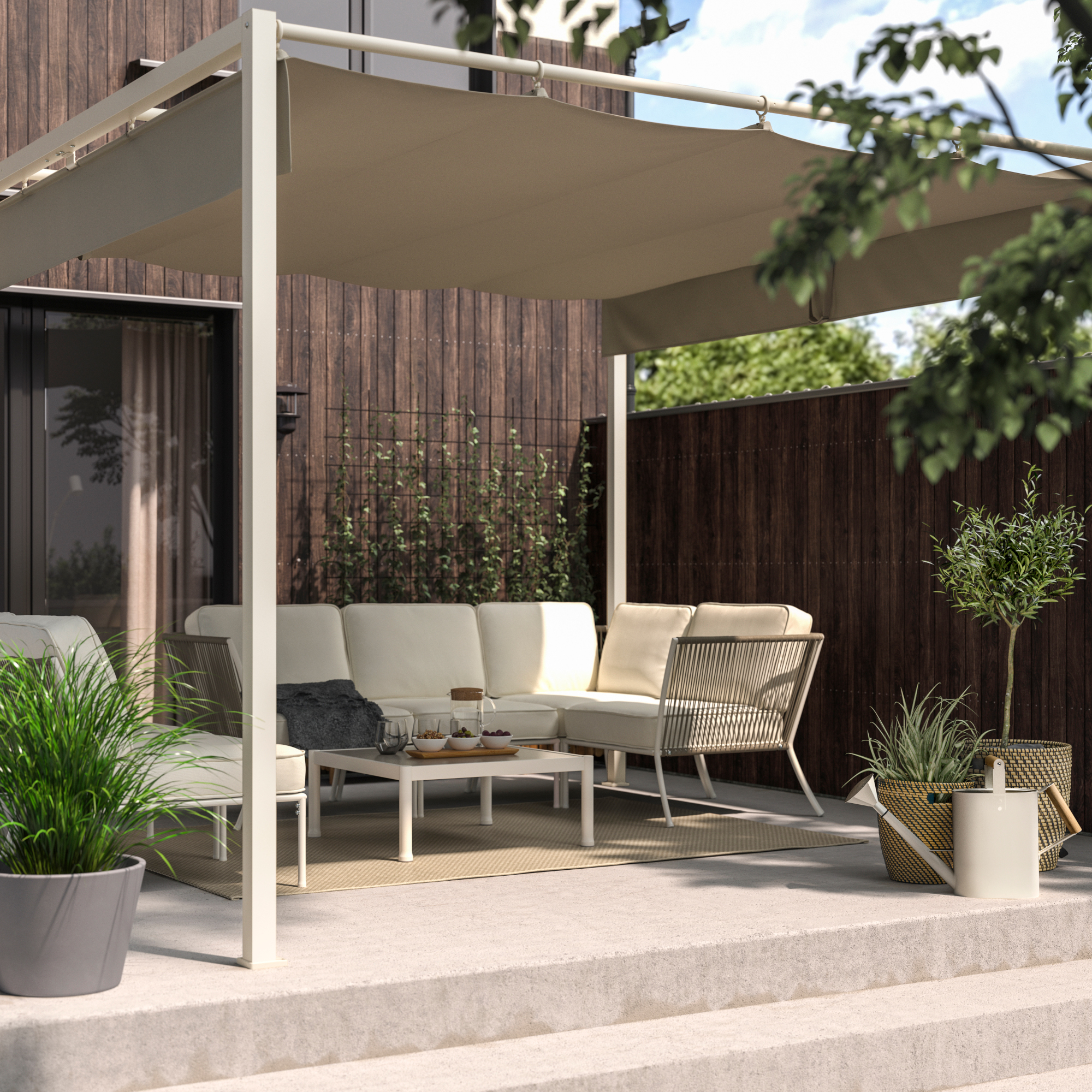 IKEA pergola with outdoor furniture on a raised patio