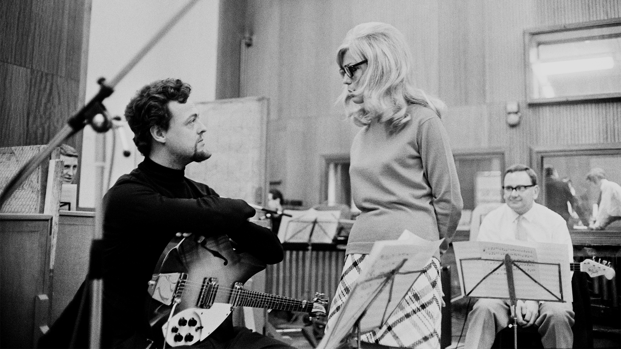 English musician Big Jim Sullivan (1941 - 2012) and American singer and actress Nancy Sinatra in a recording studio, 1967.