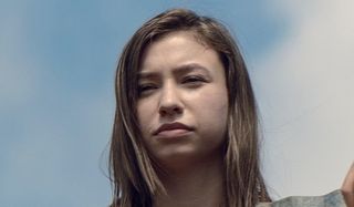 enid standing at the hilltop's wall walking dead
