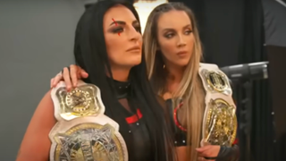 Sonya Deville and Chelsea Green participate in a photo shoot during a WWE segment.