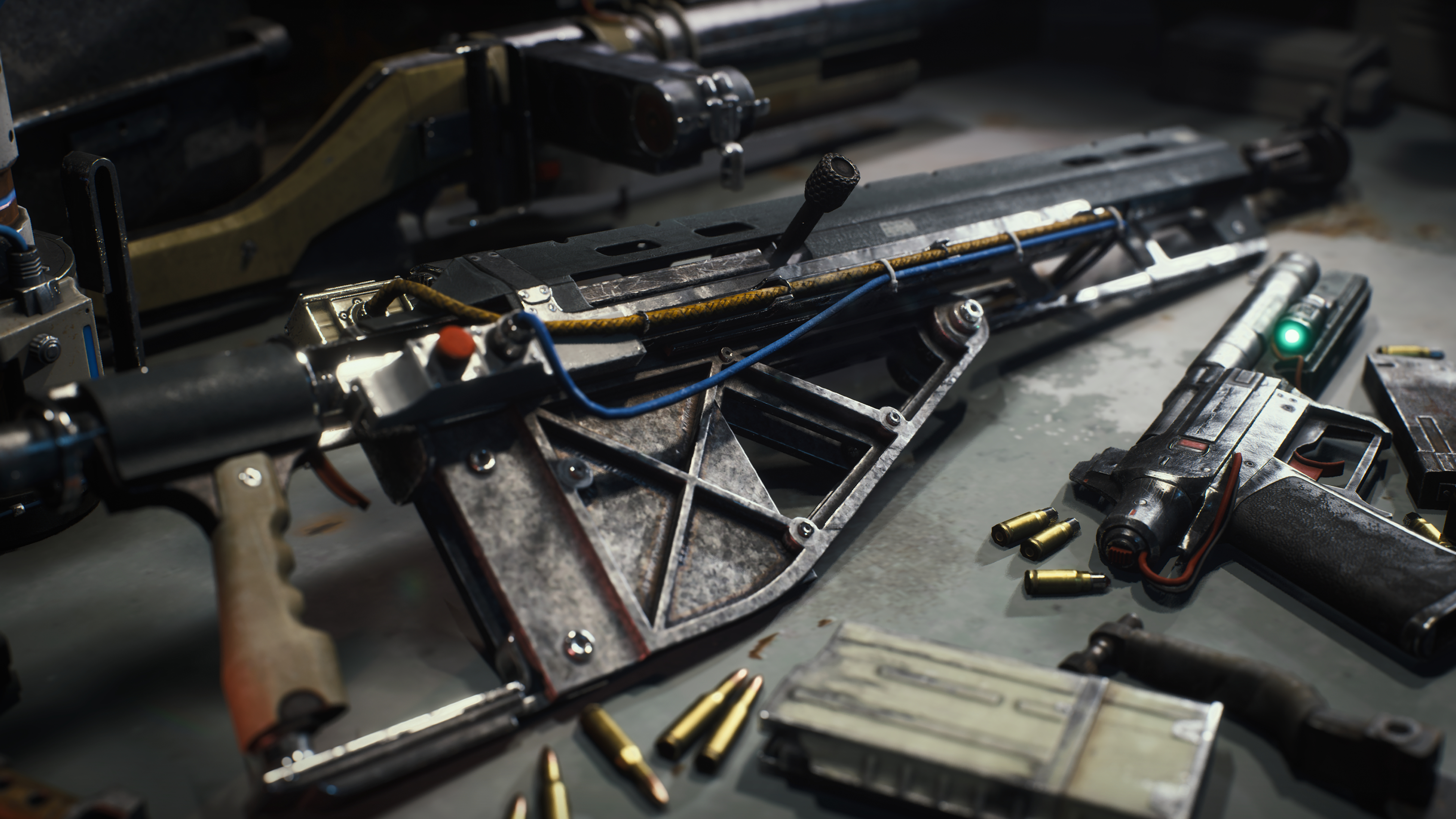 Arc Raiders weapon upgrades: A close-up shot of a makeshift gun with wires attached to it on a workbench, with other guns and ammo scattered around.