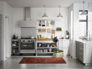 A small kitchen space with freestanding work surfaces and plenty of storage