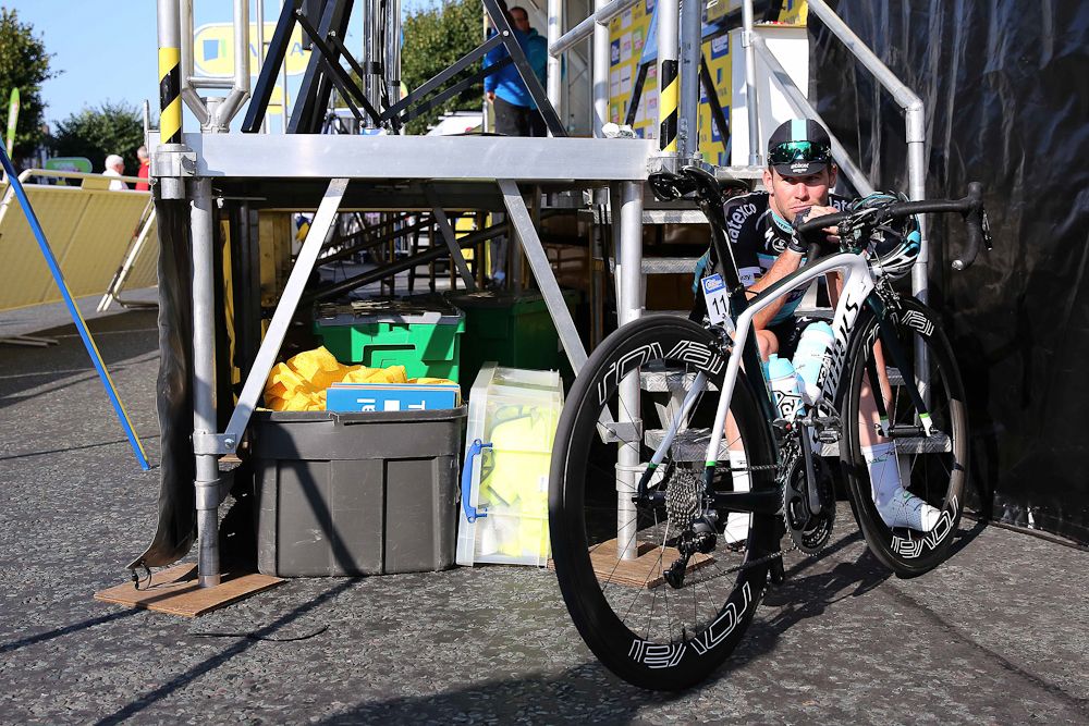 Mark Cavendish waits near the podium.